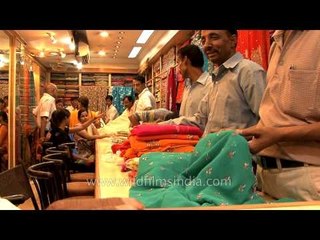 Vibrant and colourful sarees for sale at a shop in Varanasi