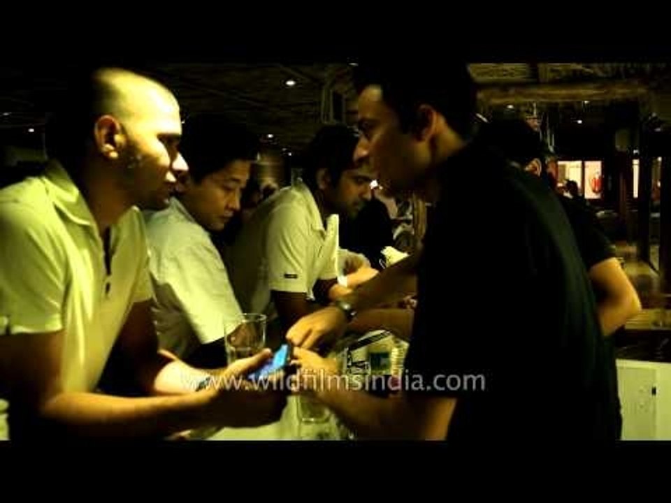 Bartenders serving drinks to visitors at Dzukou restaurant