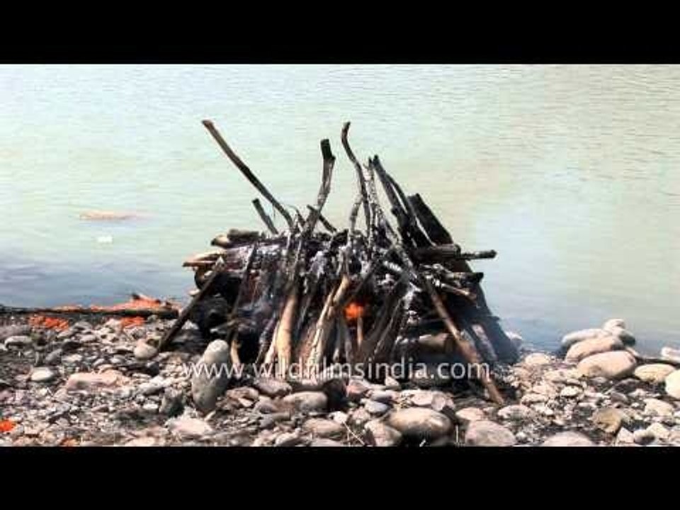 Hindu dead body being cremated along banks of Ganga - Chandi Ghat