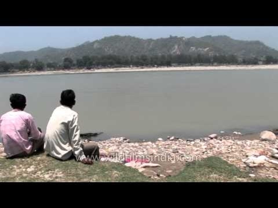 Burning flames of a pyre consume the body at Chandi cremation ghat