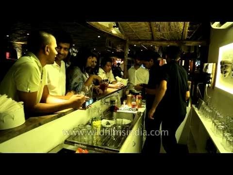 Bartenders at Dzukou restaurant serving beer