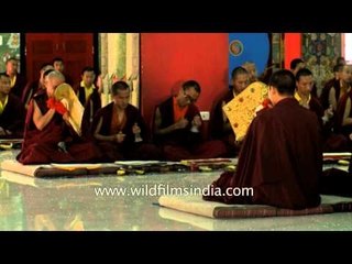 Monks blowing ceremonial trumpets or dungchen