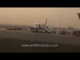 Sahara plane taxiing on Delhi airport runway