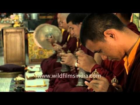 Monks snapping their fingers as a part of their ritual during evening prayer