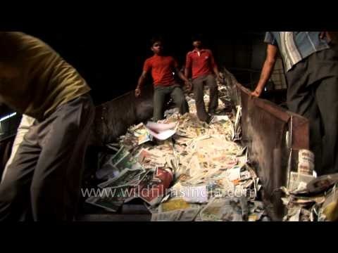 Indian workers recycling American paper trash