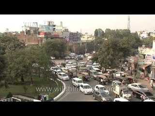 Traffic moves along a busy road in Faridabad
