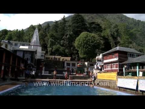 People bathing in fresh water tank at Bhagsunag Temple