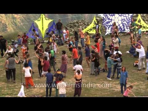 Floor art adorns the ground close to an enthusiastic crowd of dancers