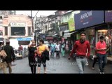 People walking down the Mall road in Mussoorie