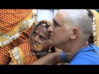 Groom's brother posing for a picture after pre-wedding rituals