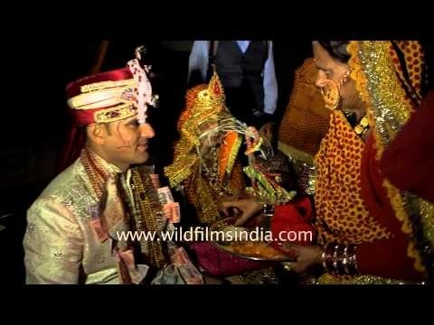 Relatives blessing the newly married couple