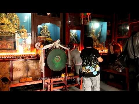 Lord Buddha devotees offering prayers inside the temple