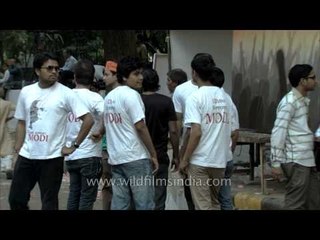 Supporters wearing t-shirt with a portrait of Modi thronged BJP office, Delhi