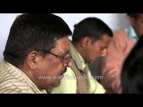 People performing 'havan' as a ritual of Kumaoni wedding