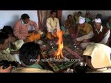 Groom performing 'havan' with relatives - Rituals of Kumaoni wedding