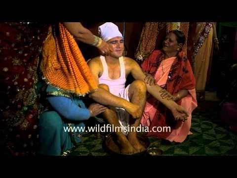 Relatives applying 'haldi' to the groom : Kumaoni wedding