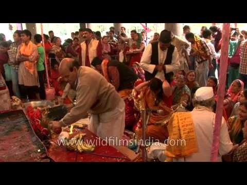 Hindu pandits perform religious rituals during Nanda Devi Mahotsav