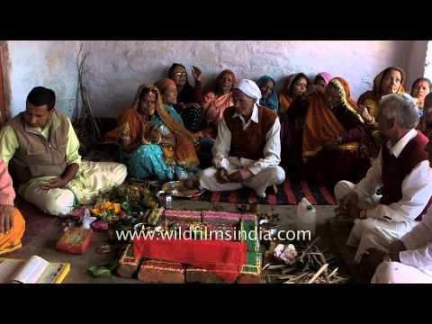 Groom's family performing rituals during a havan
