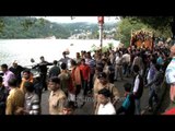 Devotees join procession carrying the Dola of Nanda Devi in Nainital