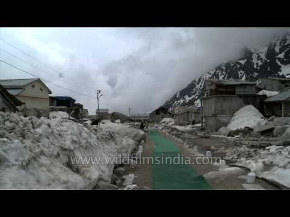 Washed-out houses of Kedarnath covered in snow