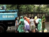 Water shortage - people collecting water from Delhi Jal Board tanker