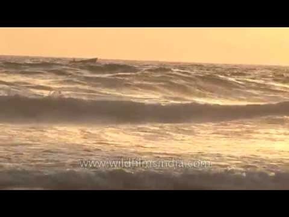 Lonely boat sailing through high waves, Kanyakumari