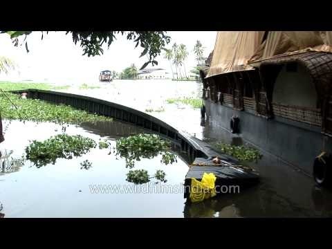 Partially submerged snake-boat at the backwaters of Kerala