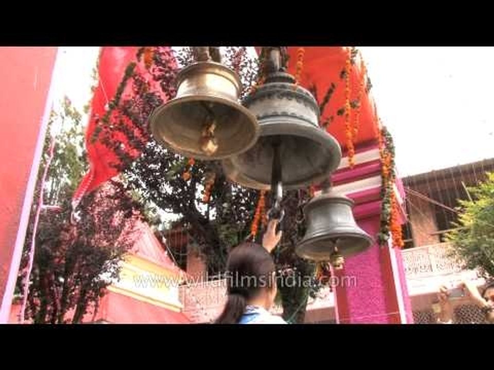 Hindu devotees ringing temple bells in Nainital