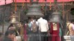 Hindu devotees ringing the temple bells at Naina Devi Temple