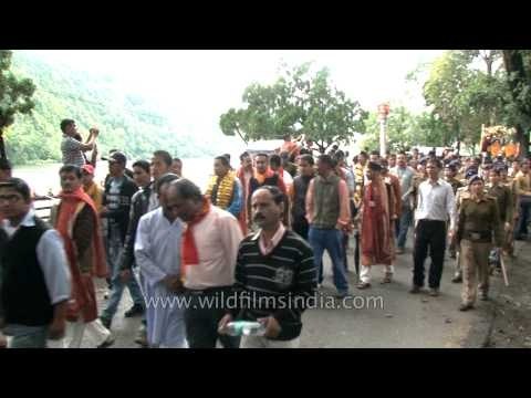 Enthusiatic devotees in a procession to celebrate Nanda Devi Mahotsav