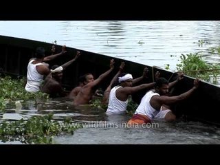 Traditional snake boat overturned at  Punnamada Backwater, Kerala