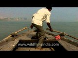 Paddling hard in the banks of river Ganges - Varanasi