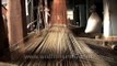 Artisan weaving Banarasi saree in a hand loom factory - Varanasi