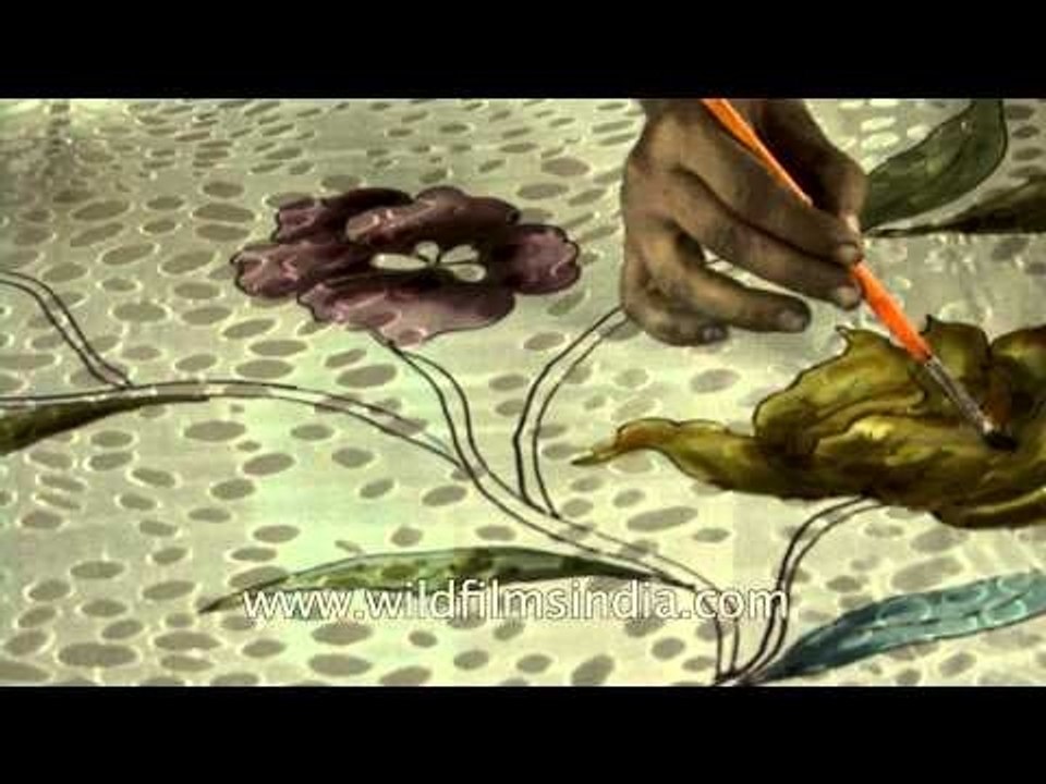 Artisans making intricate motifs on a Banarasi silk saree