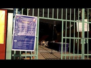 Old woman casting her vote at the general election 2014