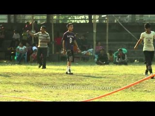 Young boys warm up before the match during Yaoshang Sports Meet