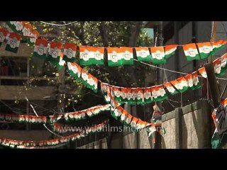 Congress flag bunting hangs over a street in Delhi