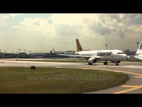 Tigerair jet taxiing on Kuala Lumpur airport runway