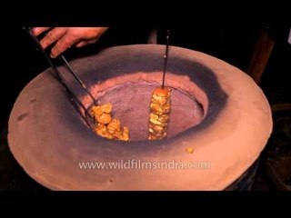 Juicy tikkas come out of the earthen oven