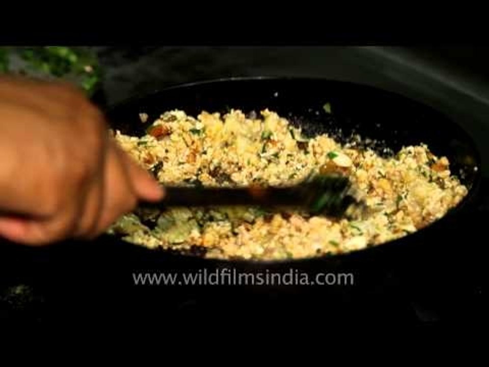 Chef preparing a delicious meal at Kanha Earth Lodge