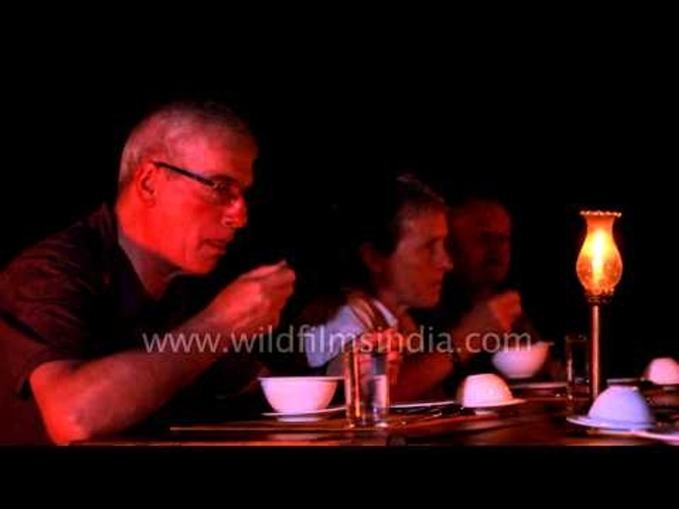 Guests enjoying a delicious dinner at Kanha Earth Lodge