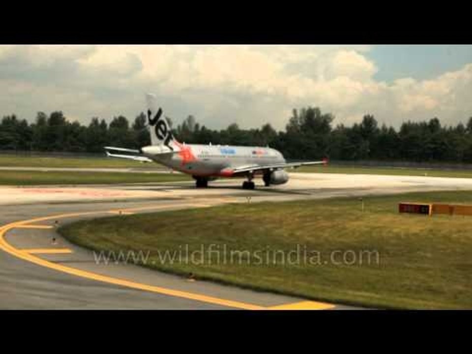 Low-cost Australian Airline: Jetstar Valuair taxiing on tarmac