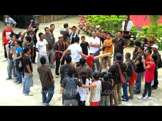 Funny Mizo indigenous game : two people hit each other with sacks