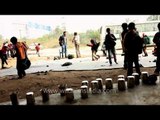 Children of School under metro bridge enjoying milk and snacks