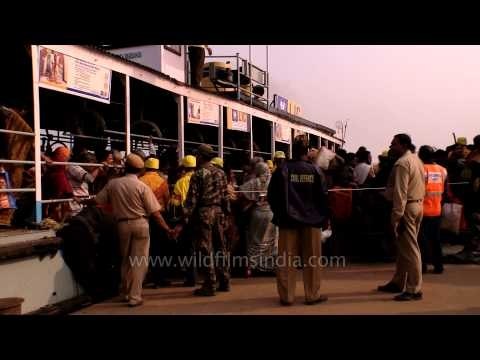 Hindu pilgrims board the ferry to reach Gangasagar mela