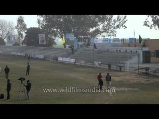 Volunteers setting up goal post for the hockey match: Kila Raipur