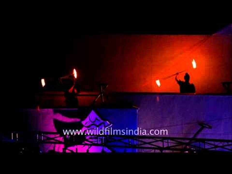 Fire jugglers light trails during Sangai Festival