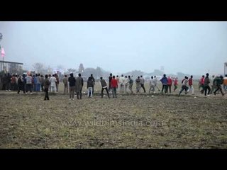 Participants controlling their bull at race