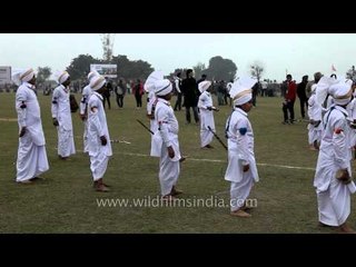 Young boys performing Bhangra using Sapp