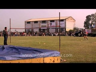Athletes fails to clear the bar in the women's high jump competition